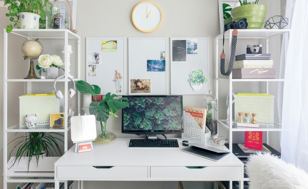 photo of cosy workplace with white furniture and plants